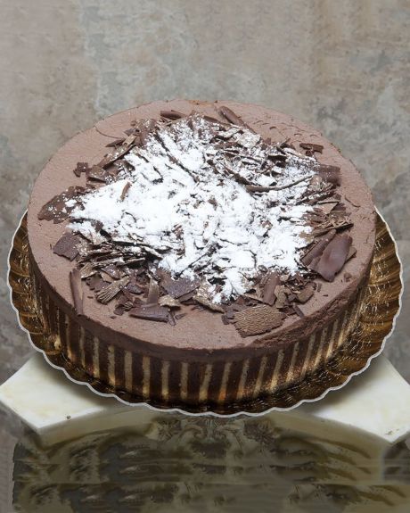 Chocolate Mousse Cake-A thin layer of stripped cake envelops a decadent chocolate mousse that is topped with extra rich chocolate shavings.-MOUSSE CAKE