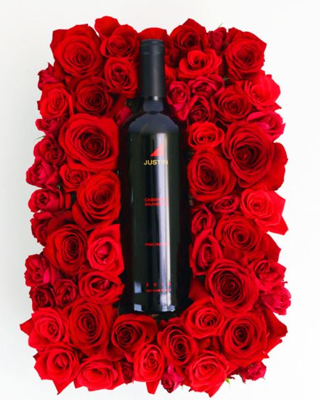 Justin Wine and bed of Roses-Justin wine rsts on a bed of red roses-Wine
