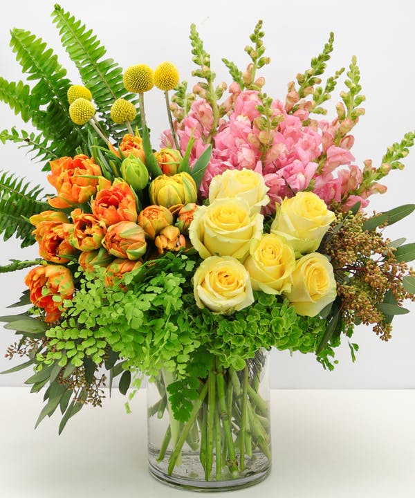 Sunsets Standard This jaw-dropping beauty features premium yellow roses, pink snap dragons, orange tulips, and more.
DELIVERY: Every order is hand-delivered direct to the recipient. These items will be delivered by us locally, or a qualified, retail, local florist.
