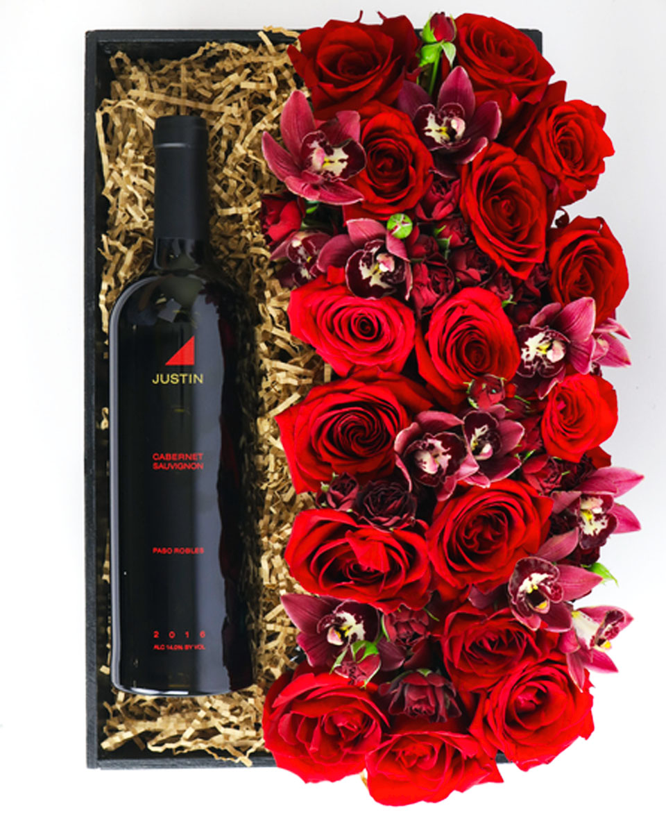 Champagne, Roses, and Orchids Dom Perignon Champagne The elegant combination of Champagne and flowers makes a classic seasonal gift.  Your choice of Dom Pérignon or Justin Cabarnet Sauvignon is matched with a stunning fresh floral arrangement of majestic red roses and cymbidium orchids arranged in a rectangular vase. 
DELIVERY: Every order is hand-delivered direct to the recipient. This item is only deliverable to local areas serviced by Allen’s Flower Market Stores. 
